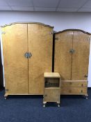 A burr walnut ladies and gentleman's wardrobe together with matching bedside cabinet