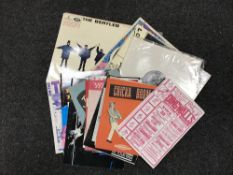 A crate containing a small quantity of LP's including Beatles, David Bowie, Rolling Stones,