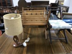 A mid twentieth century teak magazine rack,