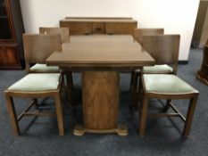 A mid twentieth century six piece walnut dining room suite