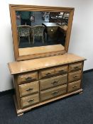 A contemporary ten drawer dressing chest with mirror