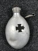A World War II canteen together with a German medal