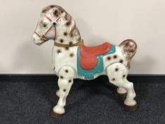 A mid twentieth century tin plate horse