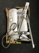A box containing two Mira Advance electric showers