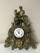 An ornate brass Imperial mantel clock,