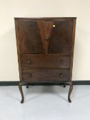 A mahogany linen chest on cabriole legs