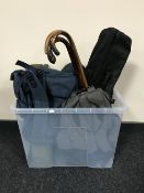 A box containing backpacks, tents in carry bags, folding seats,