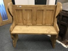 A reclaimed pine pew,