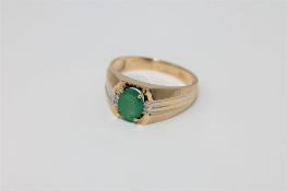 A 14ct gold emerald and diamond ring