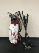 An Macgregor golf bag containing Dunlop irons,