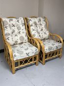 A pair of cane conservatory armchairs