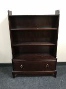 A set of Stag open bookshelves fitted a drawer in a mahogany finish