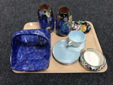 A tray containing Maling ware, including a lustre tea cup with two saucers,