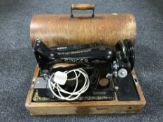 An oak cased Singer sewing machine