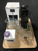 A tray containing boxed Caithness paperweight, assorted glassware,