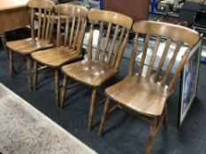A set of four pine kitchen chairs