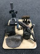 A tray containing a vintage blowtorch, live steam engine component, a Canco microscope,