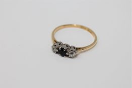 An 18ct gold sapphire and diamond ring