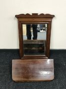 A late 19th century mahogany wall mirror with shelf