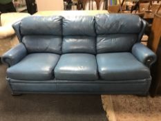 A Pemoragon blue leather three seater settee