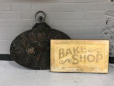 A bake shop advertising sign,