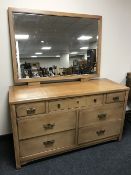 A dressing chest fitted seven drawers with brass drop handles