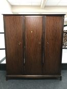 A Stag triple door wardrobe in a mahogany finish