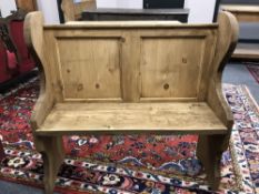 A reclaimed pine pew,