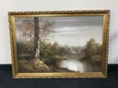 A gilt framed oil on canvas depicting a river,