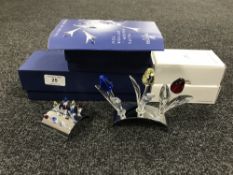 Three Swarovski Crystal tulips on stand together with accompanying nine miniature tulips on stand,