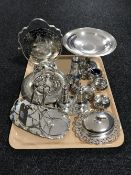 A collection of silver plated wares including a toast rack, a bottle stand, sifters, cruet set,