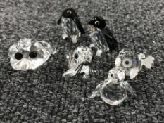 Six un-boxed Swarovski Crystal figures; frog, puffer fish, walrus and three penguins.
