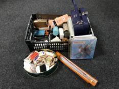 A basket containing assorted sewing equipment, greetings card book,