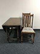 An oak drop leaf barley twist dining room table,
