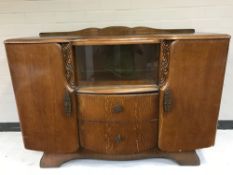 A mid 20th century oak sideboard