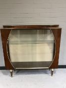 A mid 20th century walnut cocktail cabinet