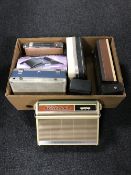 A box containing seven assorted transistor sets and one valve portable