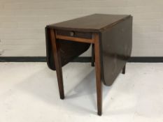 An early twentieth century mahogany drop leaf table