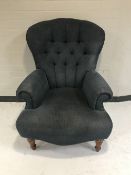 A Victorian style button back armchair