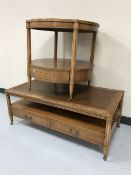 A mahogany leather topped coffee table fitted two drawers and a matching side table