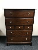 A Stag seven drawer chest in a mahogany finish