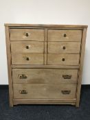 A five drawer chest with brass drop handles