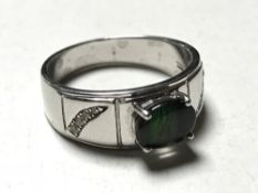 A silver opal set ring