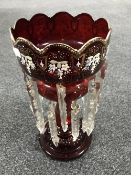 A Victorian ruby red glass lustre with drops