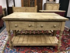 A reclaimed pine two drawer side table,