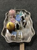 A silver plated gallery tray containing assorted glass paperweights including Caithness,