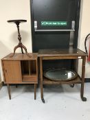 An oak trolley, oval framed mirror,
