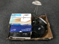 A box containing a desk lamp, extension lead, a CD digital radio,