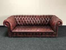 A Chesterfield button back club three seater settee in oxblood leather CONDITION REPORT: