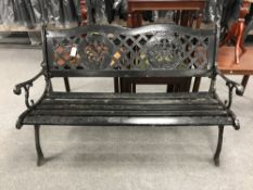 A cast iron and wood garden bench